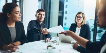 people sitting at conference table